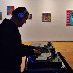 Photo of DC Bace Monk playing 7" vinyl